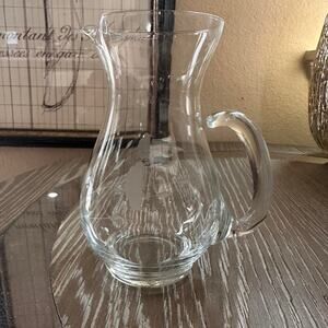 Clear glass pitcher with etched